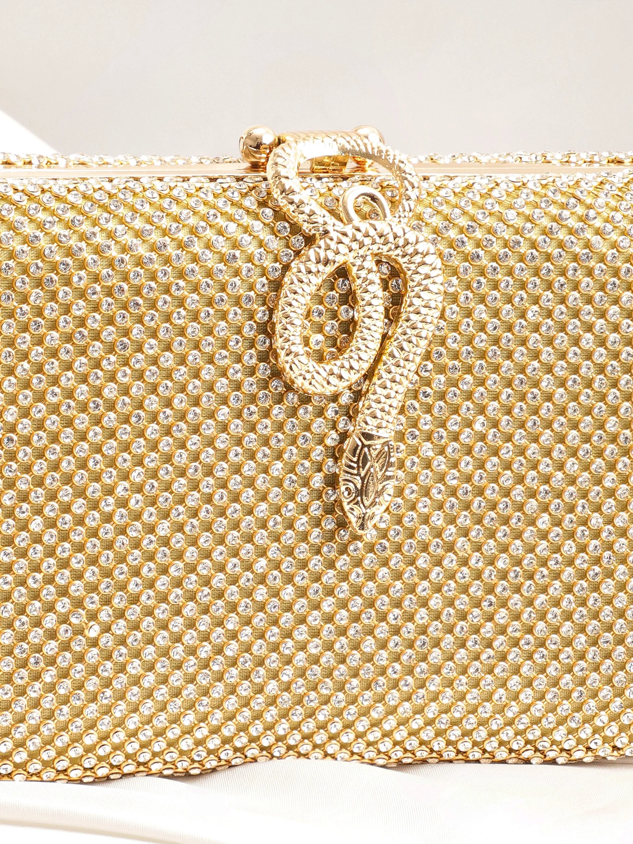 Rubans Gold With Dazzling Crystal Zirconia Embellished Serpent motif Clutch handbag